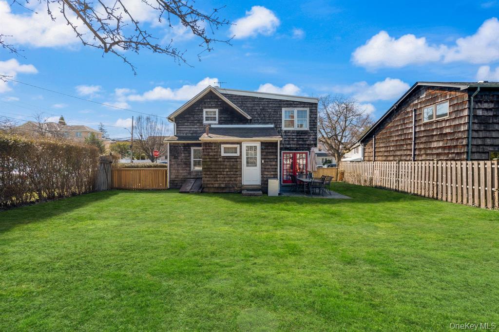217-19 39th Avenue Queens, NY 11361 - Photo 26 of 38 a front view of a house with a garden