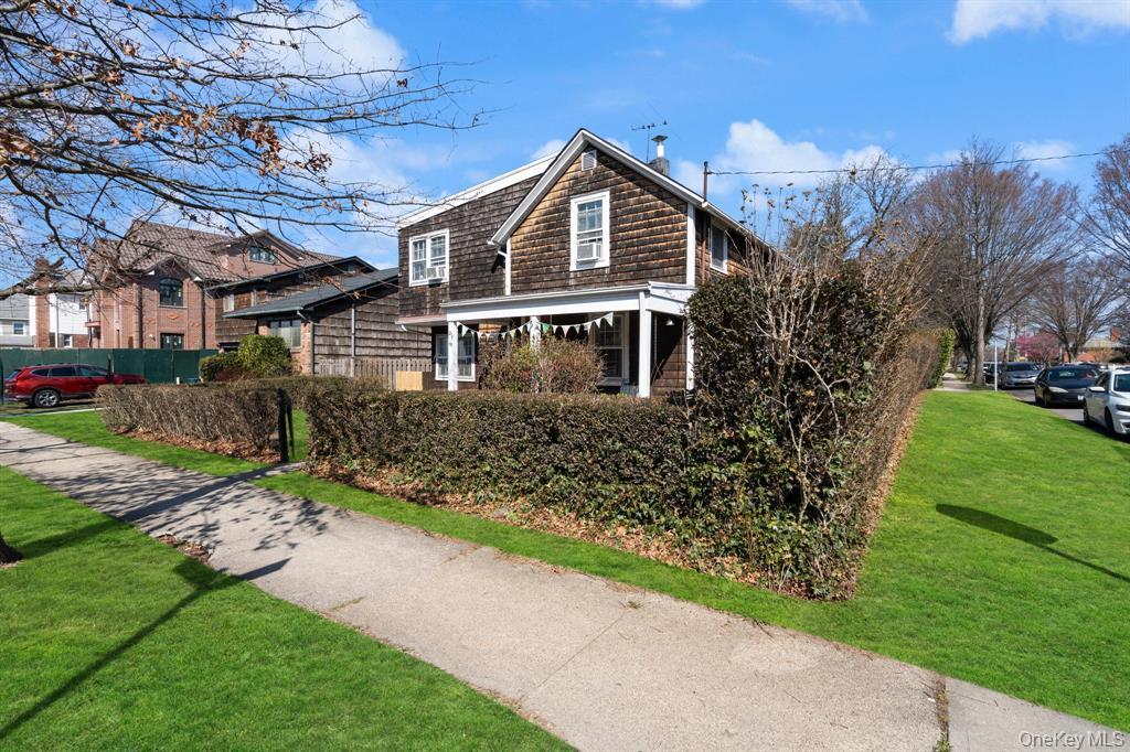 217-19 39th Avenue Queens, NY 11361 - Photo 27 of 38 a front view of a house with a garden