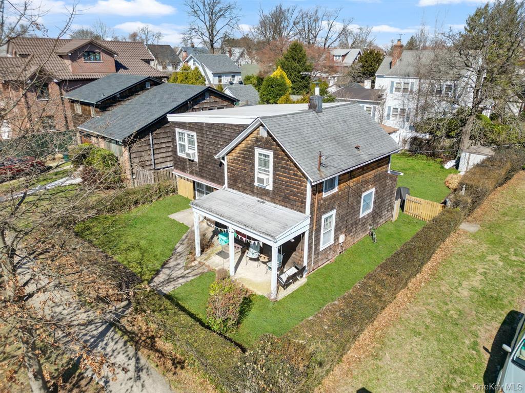 217-19 39th Avenue Queens, NY 11361 - Photo 33 of 38 an aerial view of a house with a big yard