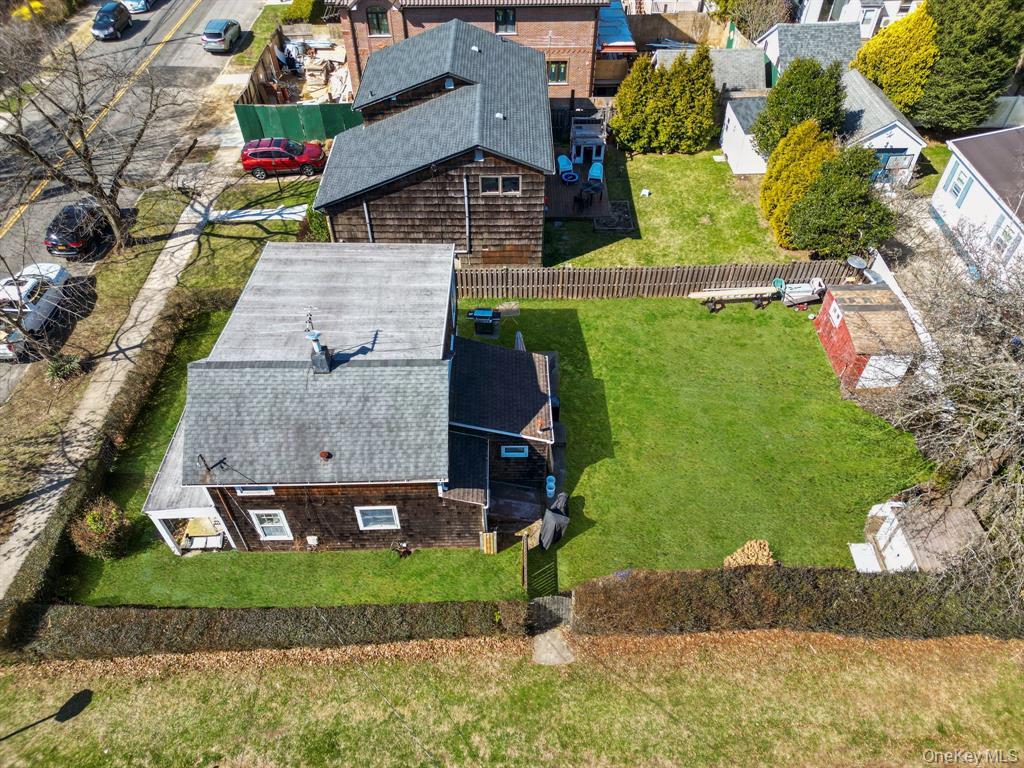 217-19 39th Avenue Queens, NY 11361 - Photo 34 of 38 an aerial view of a house with a yard