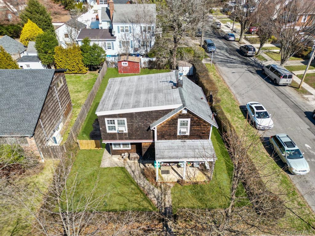 217-19 39th Avenue Queens, NY 11361 - Photo 4 of 38 an aerial view of a house with swimming pool and large trees