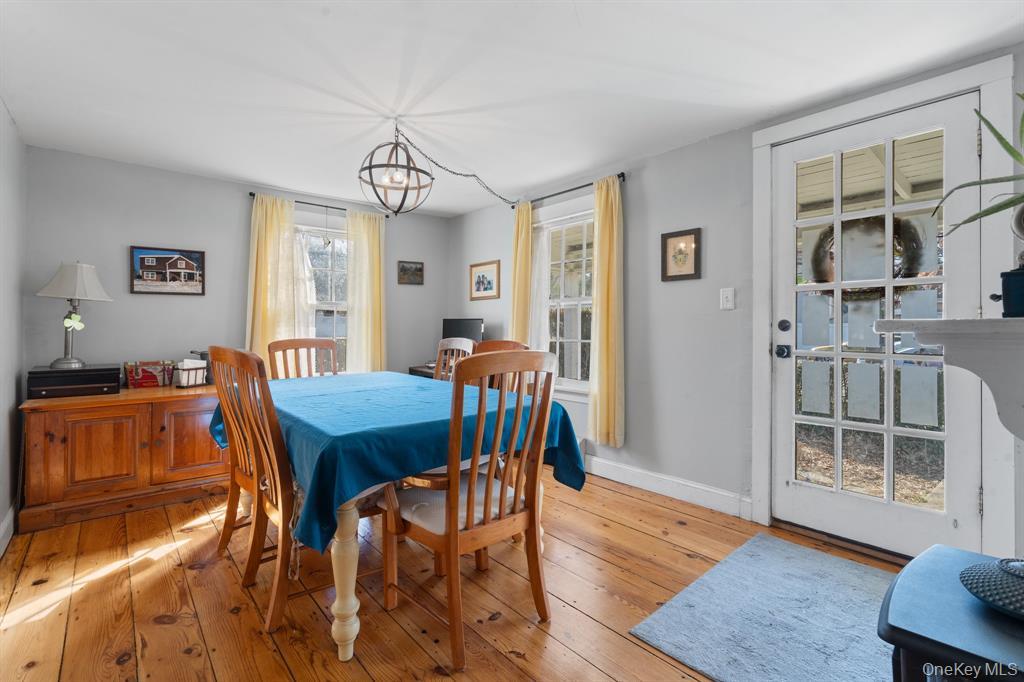 217-19 39th Avenue Queens, NY 11361 - Photo 7 of 38 a view of a dining room with furniture and wooden floor