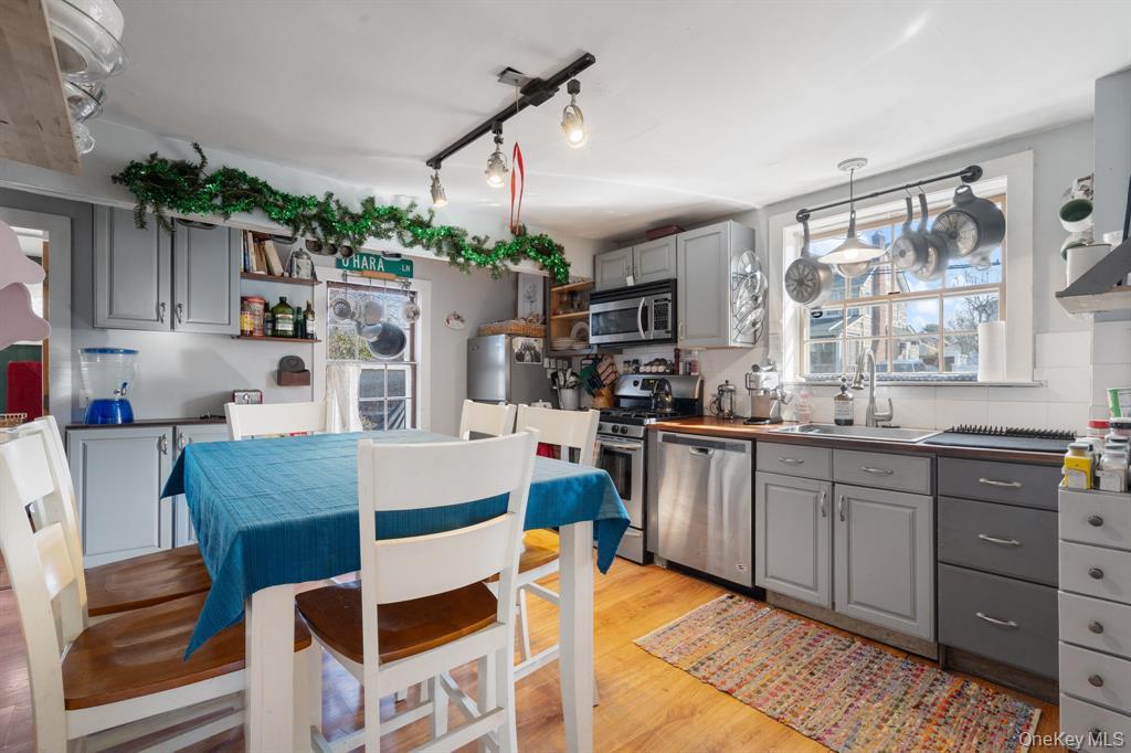 217-19 39th Avenue Queens, NY 11361 - Photo 8 of 38 a living room with stainless steel appliances kitchen island granite countertop furniture and a kitchen view
