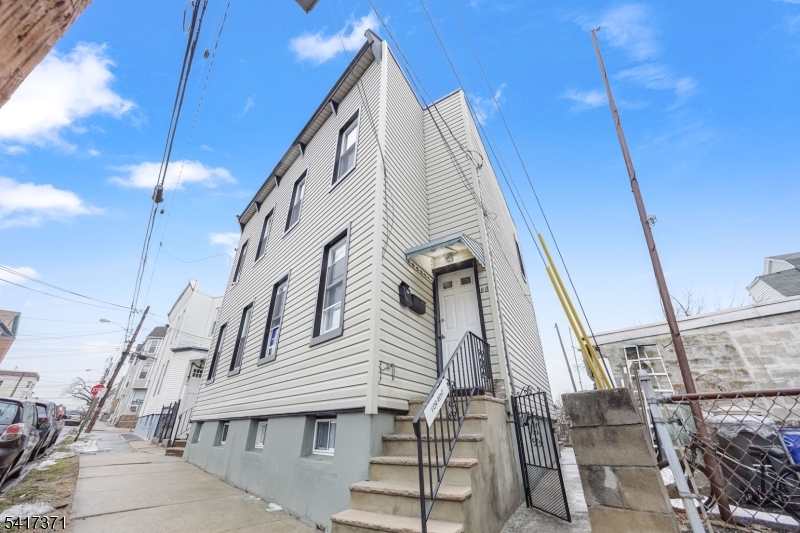 88 Devon Street Kearny, NJ 07032 - Photo 16 of 16 a view of entryway and hall with wooden floor