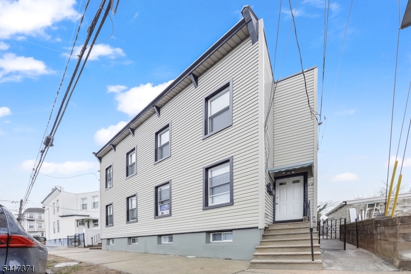 88 Devon Street Kearny, NJ 07032 - Photo 2 of 16 a view of a house with a balcony