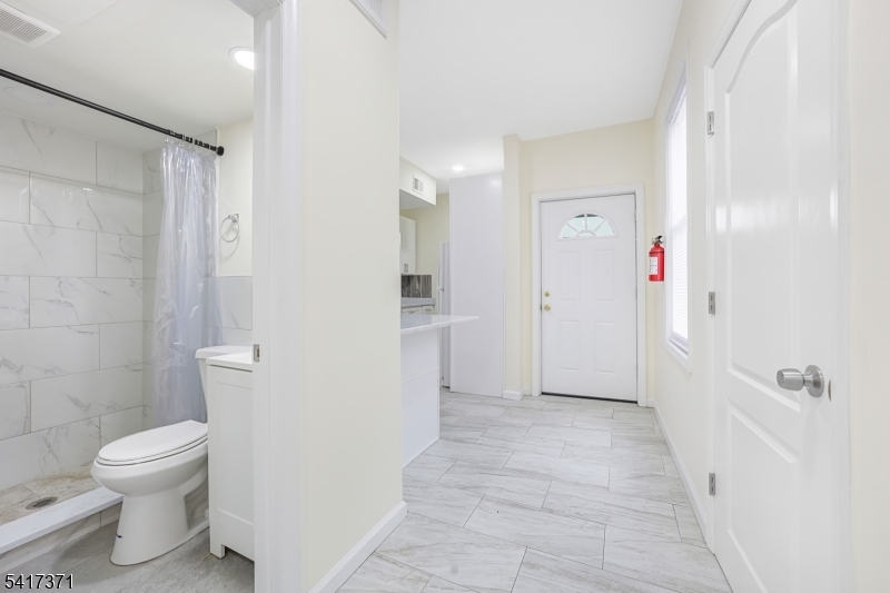 88 Devon Street Kearny, NJ 07032 - Photo 5 of 16 a bathroom with a toilet and a shower
