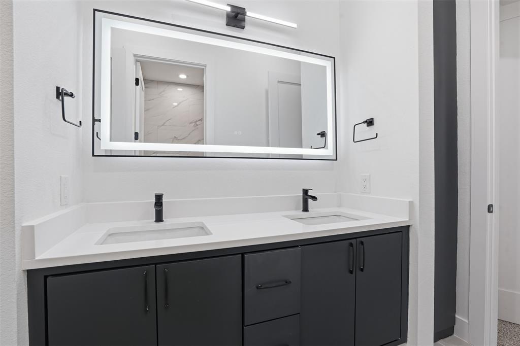 1111 Riverwood Road Dallas, TX 75217 - Photo 30 of 40 Dual vanity with white countertop and integrated sinks