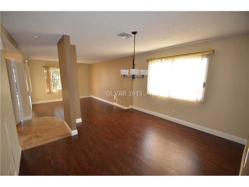 3347 Warnock Road Las Vegas, NV 89102 - Photo 9 of 21 Dining Room. separate dining and formal living area. Travertine flooring in entry; wood flooring throughout