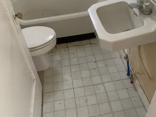 a bathroom with a toilet and a sink