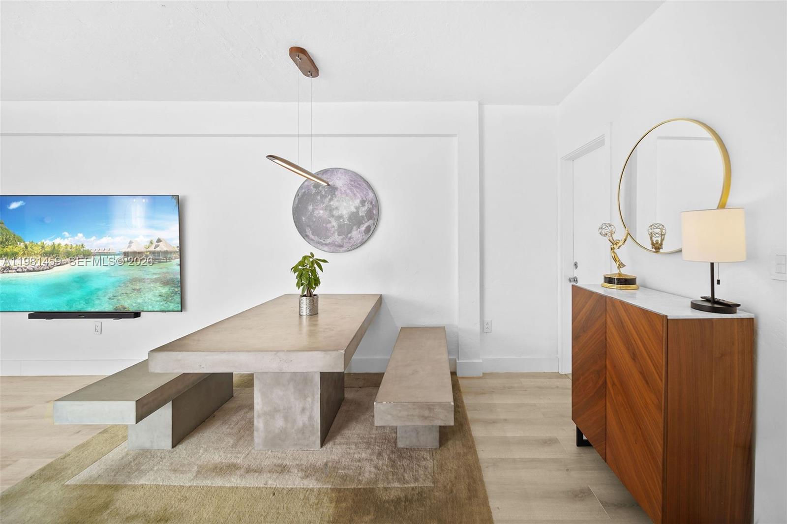 832 15th Street, Unit 4 Miami Beach, FL 33139 - Photo 15 of 17 a view of a very nice looking dining room with a table and chairs