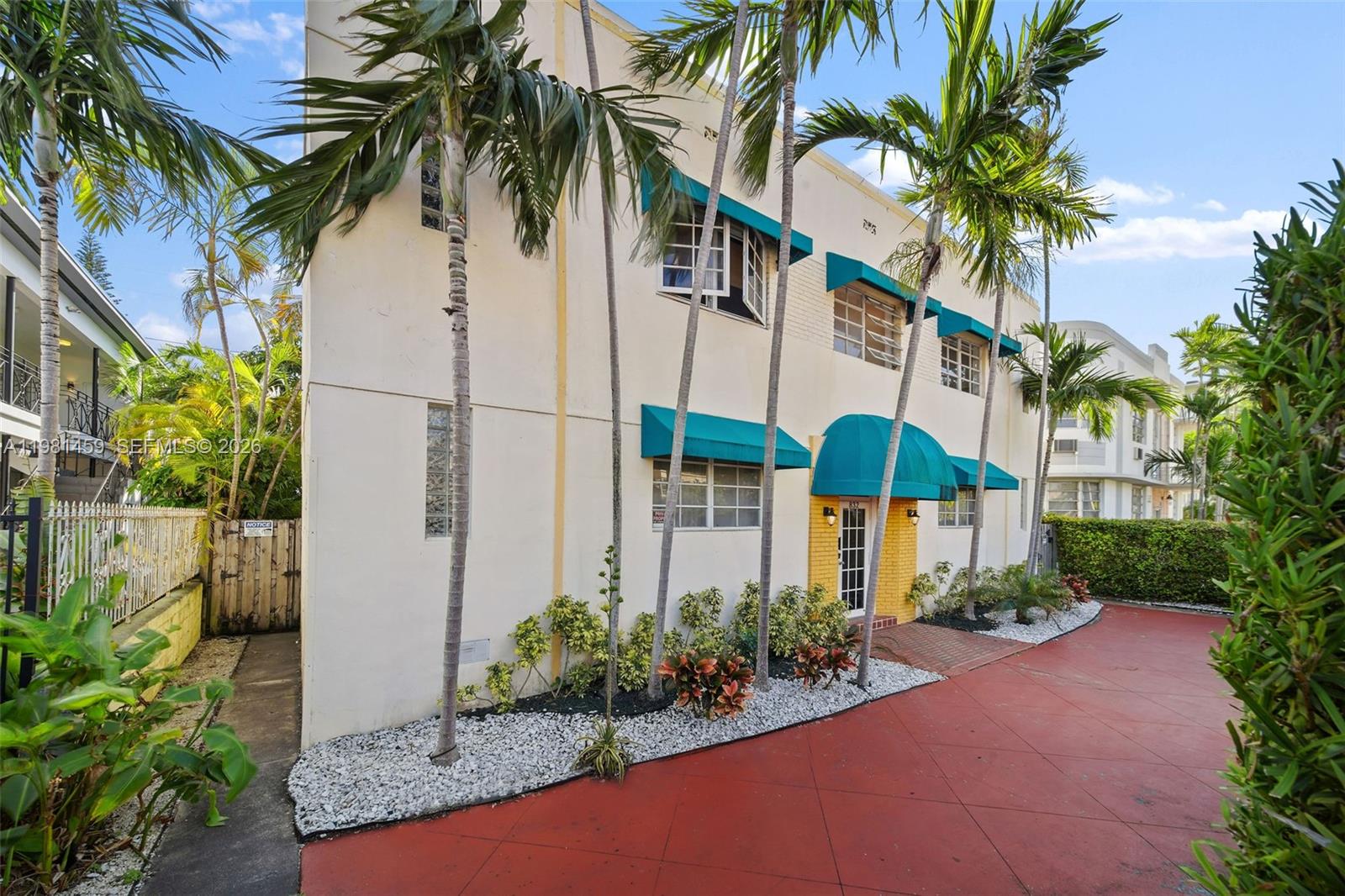 832 15th Street, Unit 4 Miami Beach, FL 33139 - Photo 17 of 17 a view of a potted plants under an palm trees