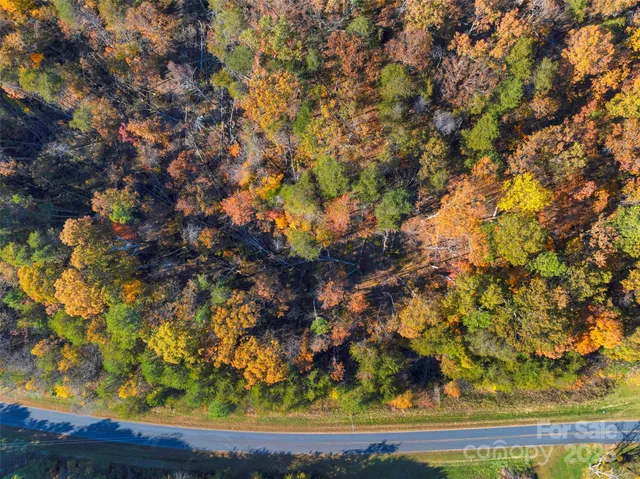 a view of swimming pool next to a yard