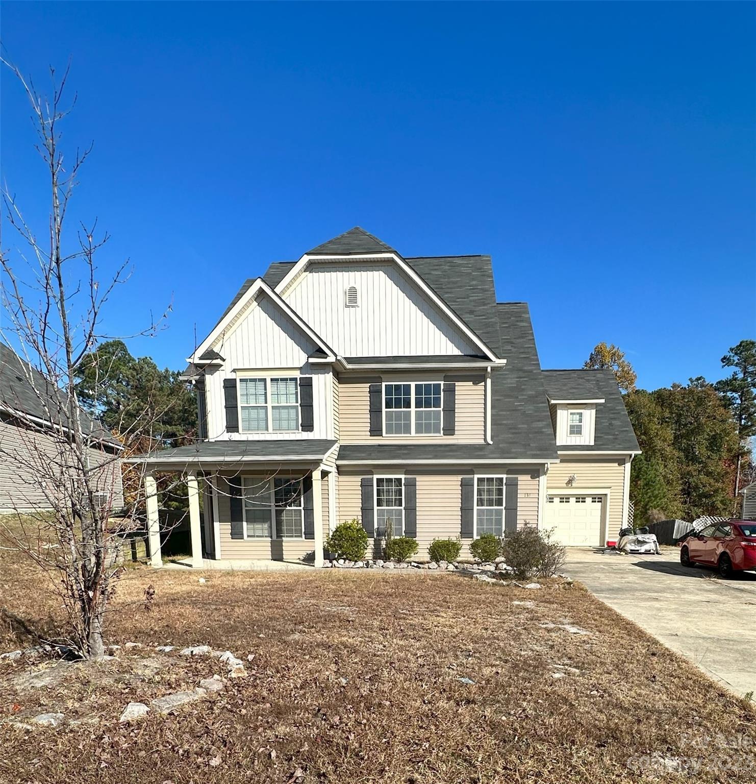 131 Revolutionary Road Cameron, NC 28326 - Photo 1 of 16 a front view of a house with a yard