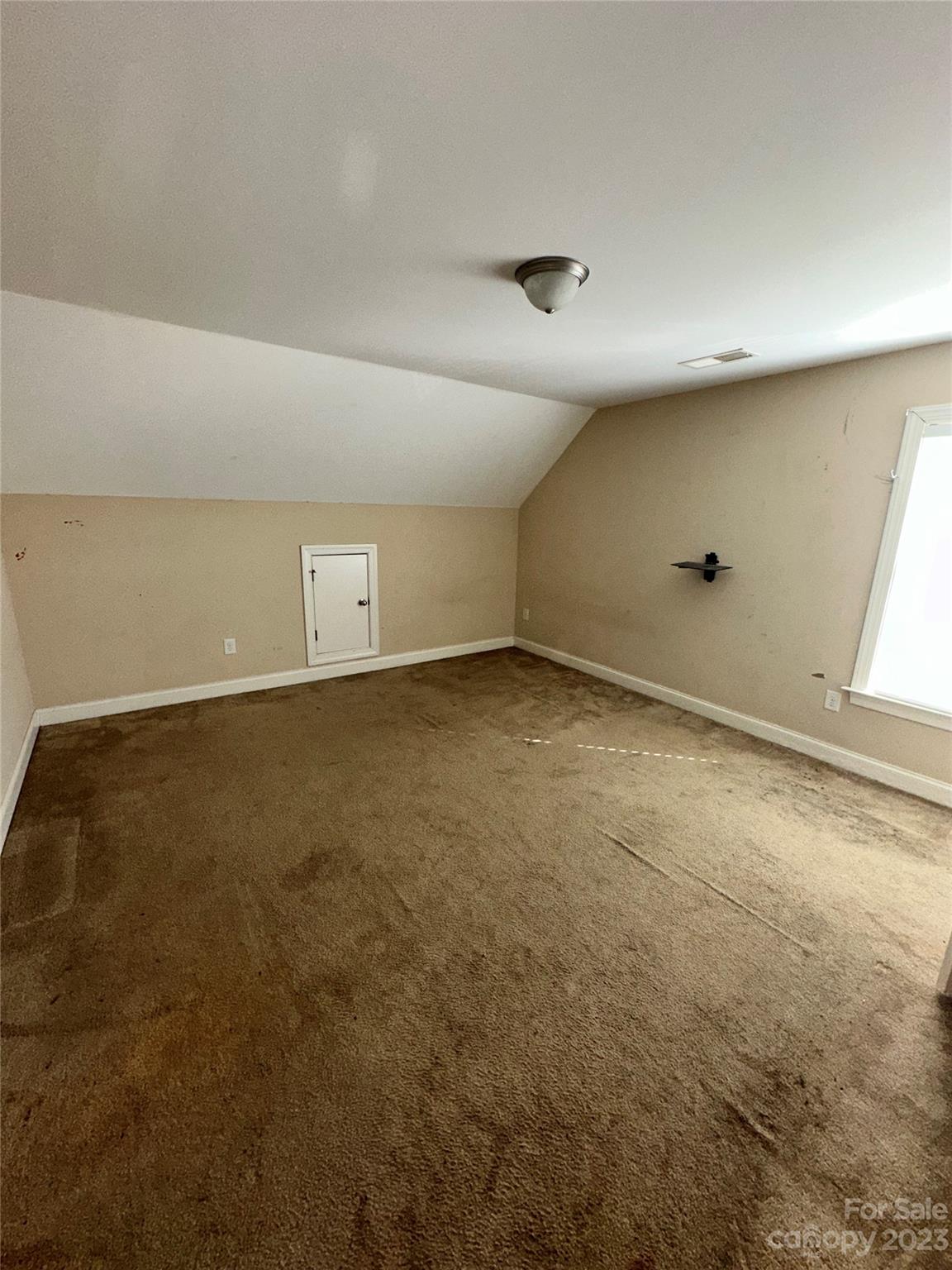 131 Revolutionary Road Cameron, NC 28326 - Photo 5 of 16 an empty room with a natural light