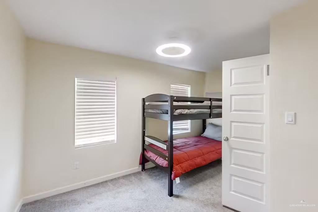 2153 El Rancho Road McAllen, TX 78503 - Photo 18 of 36 a bedroom with a bed and a window