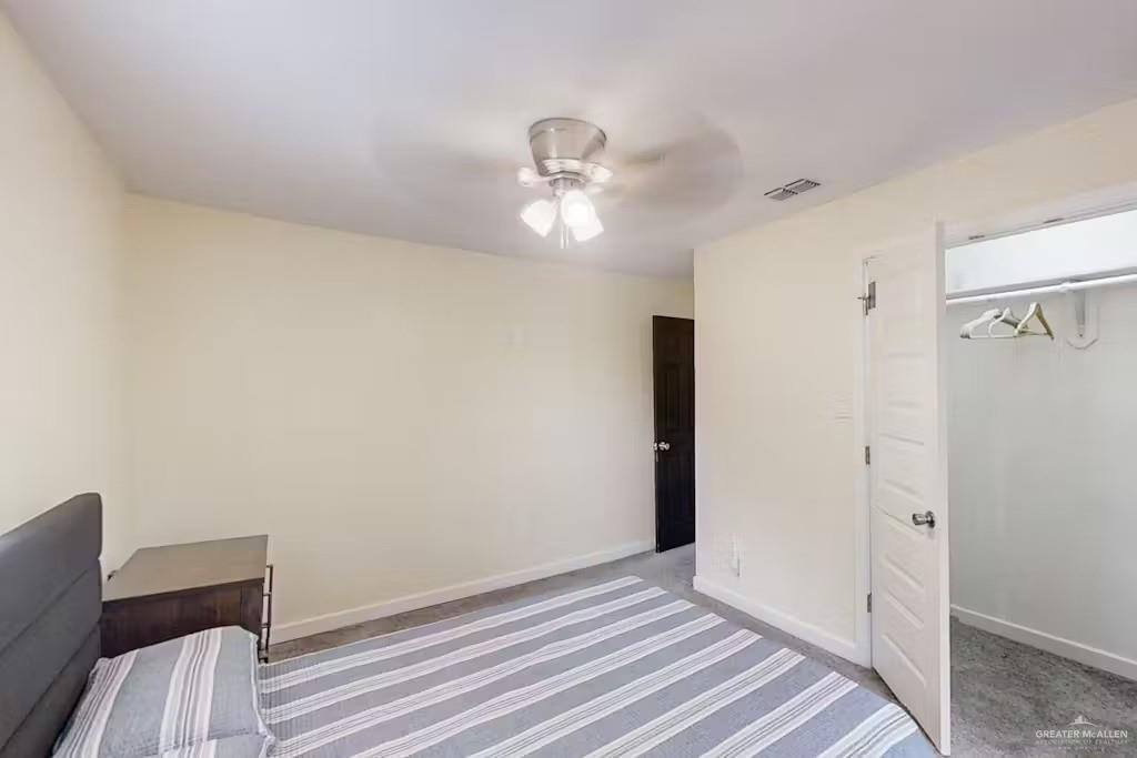 2153 El Rancho Road McAllen, TX 78503 - Photo 20 of 36 a view of a livingroom with wooden floor and a ceiling fan