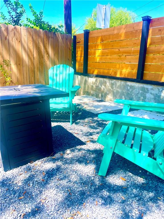 2153 El Rancho Road McAllen, TX 78503 - Photo 32 of 36 a view of a backyard with a table and chair