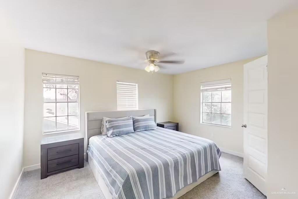 2153 El Rancho Road McAllen, TX 78503 - Photo 9 of 36 a bedroom with a large bed and a window