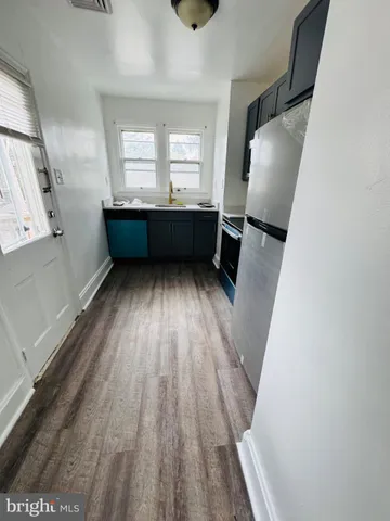 a room with wooden floor and window