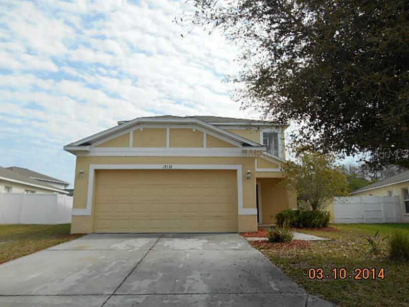 12712 White Bluff Road Hudson, FL 34669 - Photo 1 of 1 a front view of house along with trees