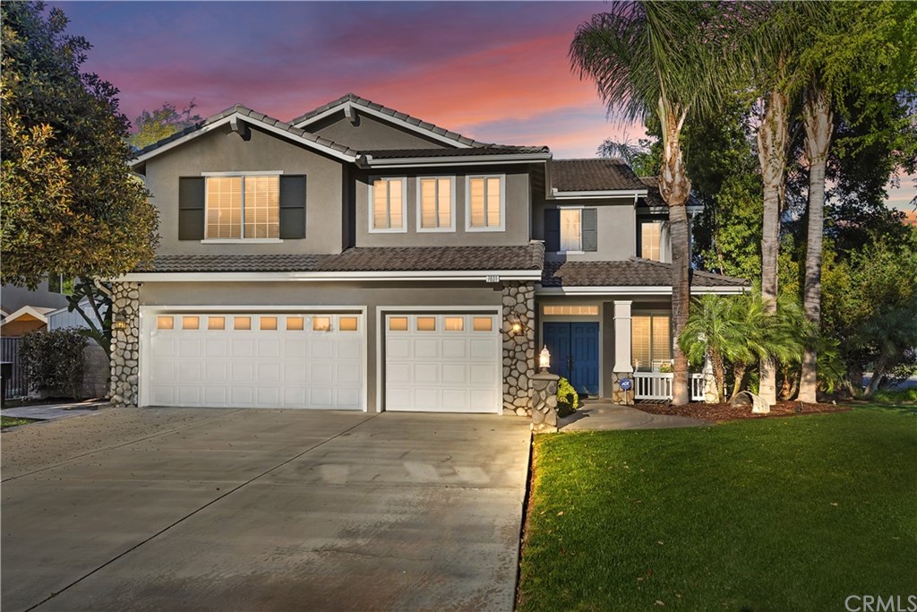 7031 Harvest Lane Riverside, CA 92506 - Photo 1 of 1 a front view of a house with a yard and garage