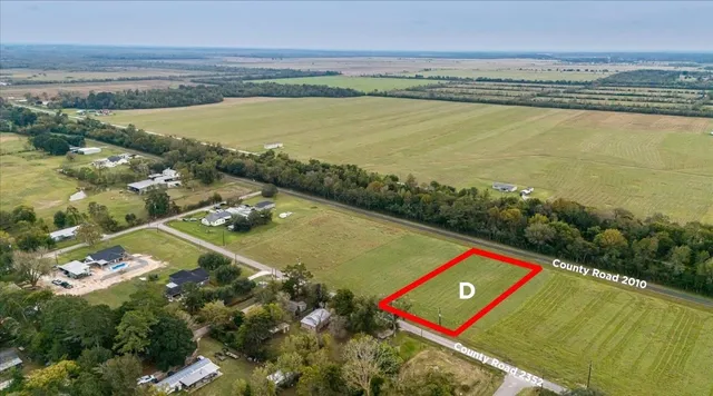 an aerial view of a city and lake view