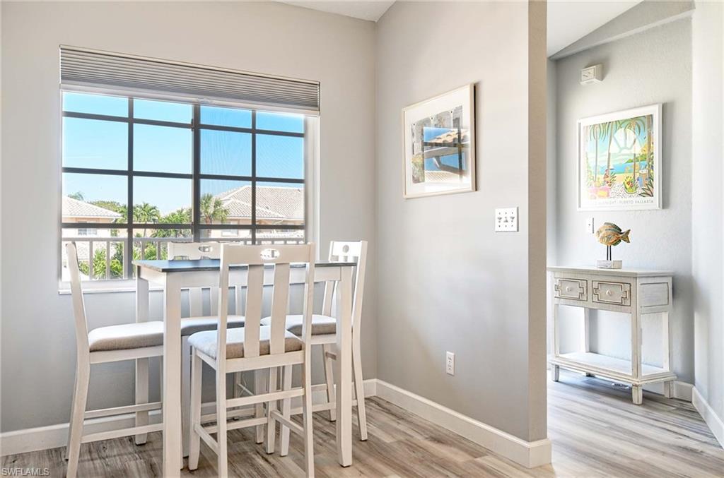 9022 Michael Circle, Unit 2210 Naples, FL 34113 - Photo 11 of 36 a dining room with furniture and window
