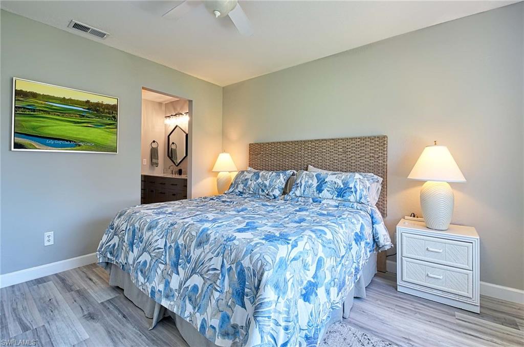 9022 Michael Circle, Unit 2210 Naples, FL 34113 - Photo 19 of 36 a bedroom with a bed and a window