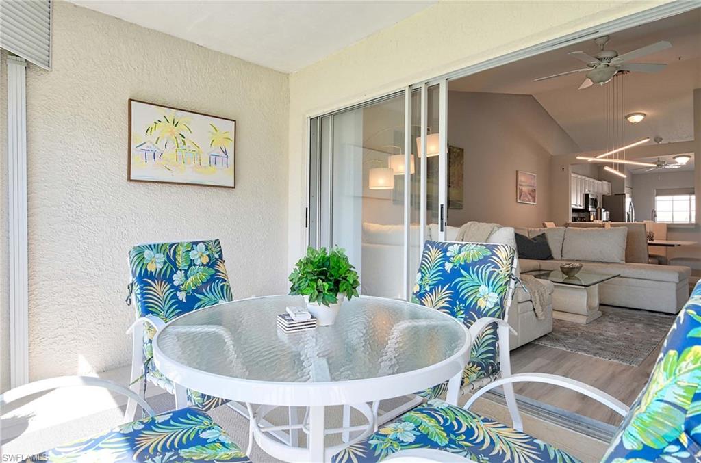 9022 Michael Circle, Unit 2210 Naples, FL 34113 - Photo 22 of 36 a living room with furniture and a potted plant