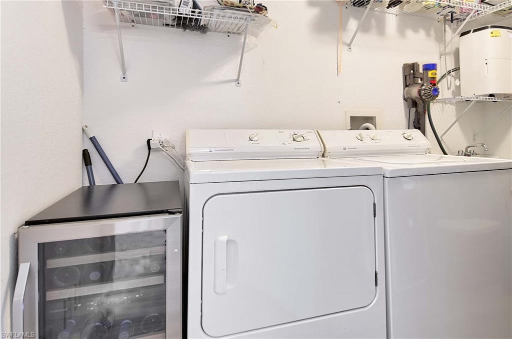 9022 Michael Circle, Unit 2210 Naples, FL 34113 - Photo 25 of 36 a utility room with dryer and washer