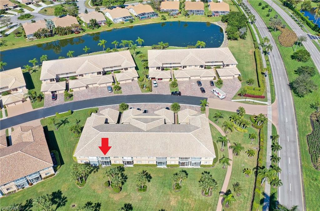 9022 Michael Circle, Unit 2210 Naples, FL 34113 - Photo 29 of 36 an aerial view of a house with a swimming pool