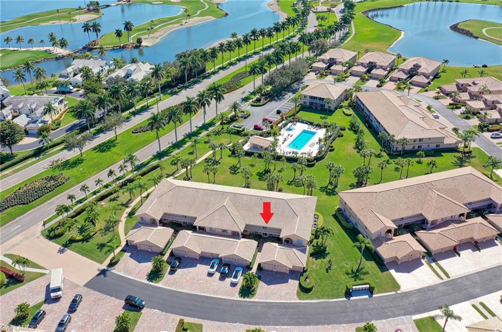 9022 Michael Circle, Unit 2210 Naples, FL 34113 - Photo 33 of 36 an aerial view of house with yard