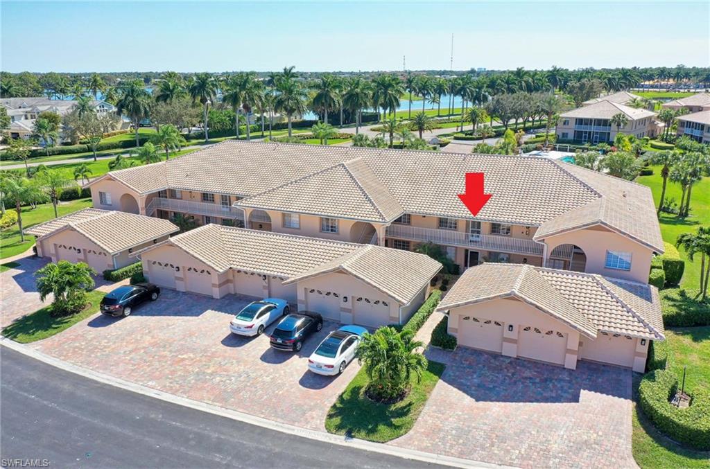 9022 Michael Circle, Unit 2210 Naples, FL 34113 - Photo 34 of 36 an aerial view of a house with garden space and outdoor seating