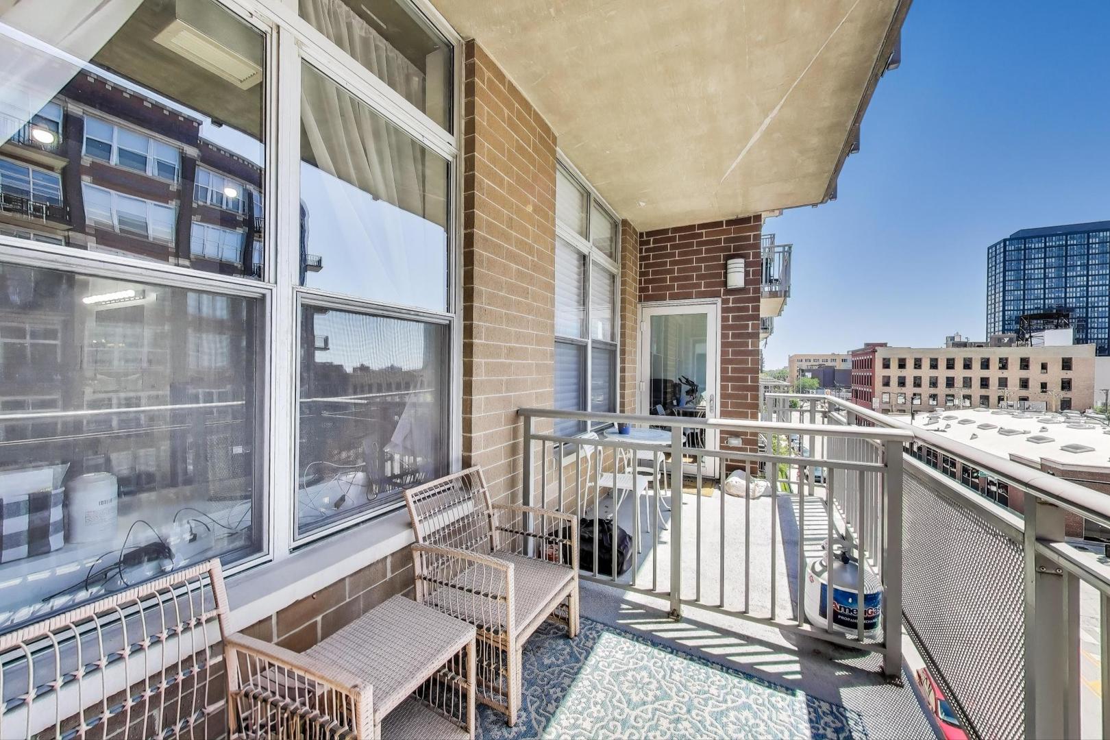 111 South Morgan Street, Unit 510 Chicago, IL 60607 - Photo 21 of 38 a view of a balcony with chairs
