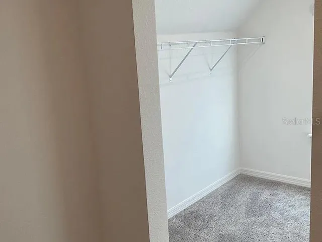 a view of an empty walk in closet