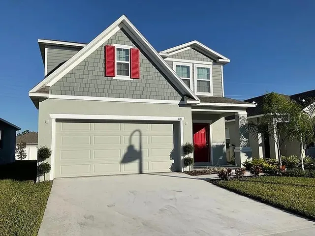 a front view of a house with yard