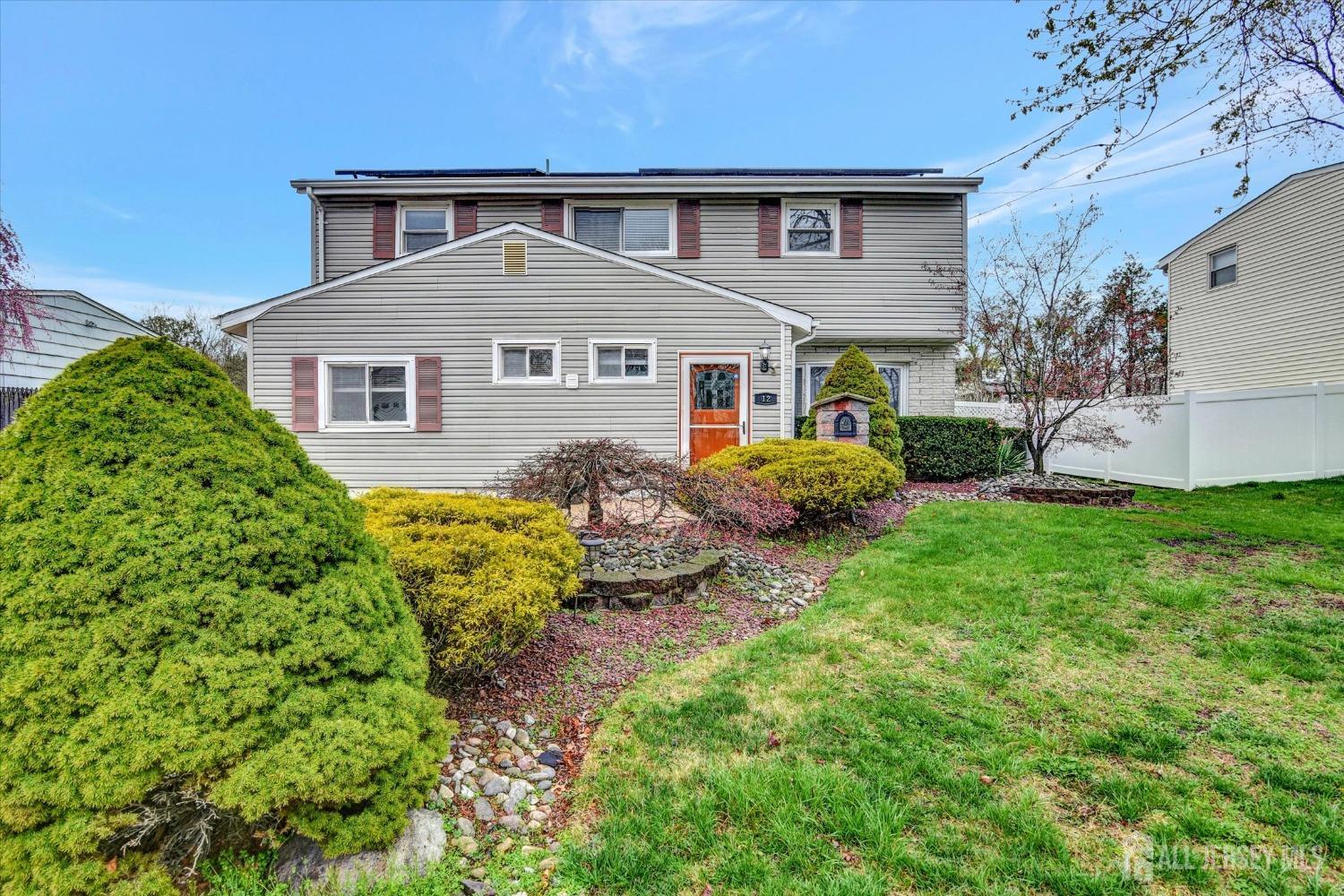 12 Albert Drive Old Bridge, NJ 08857 - Photo 2 of 20 a front view of a house with garden