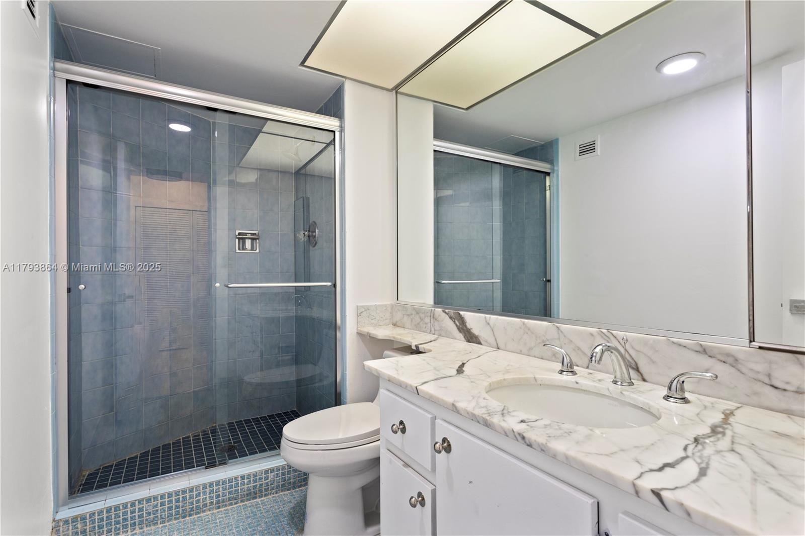 1121 Crandon Boulevard, Unit E1204 Key Biscayne, FL 33149 - Photo 14 of 21 a bathroom with a sink toilet and shower