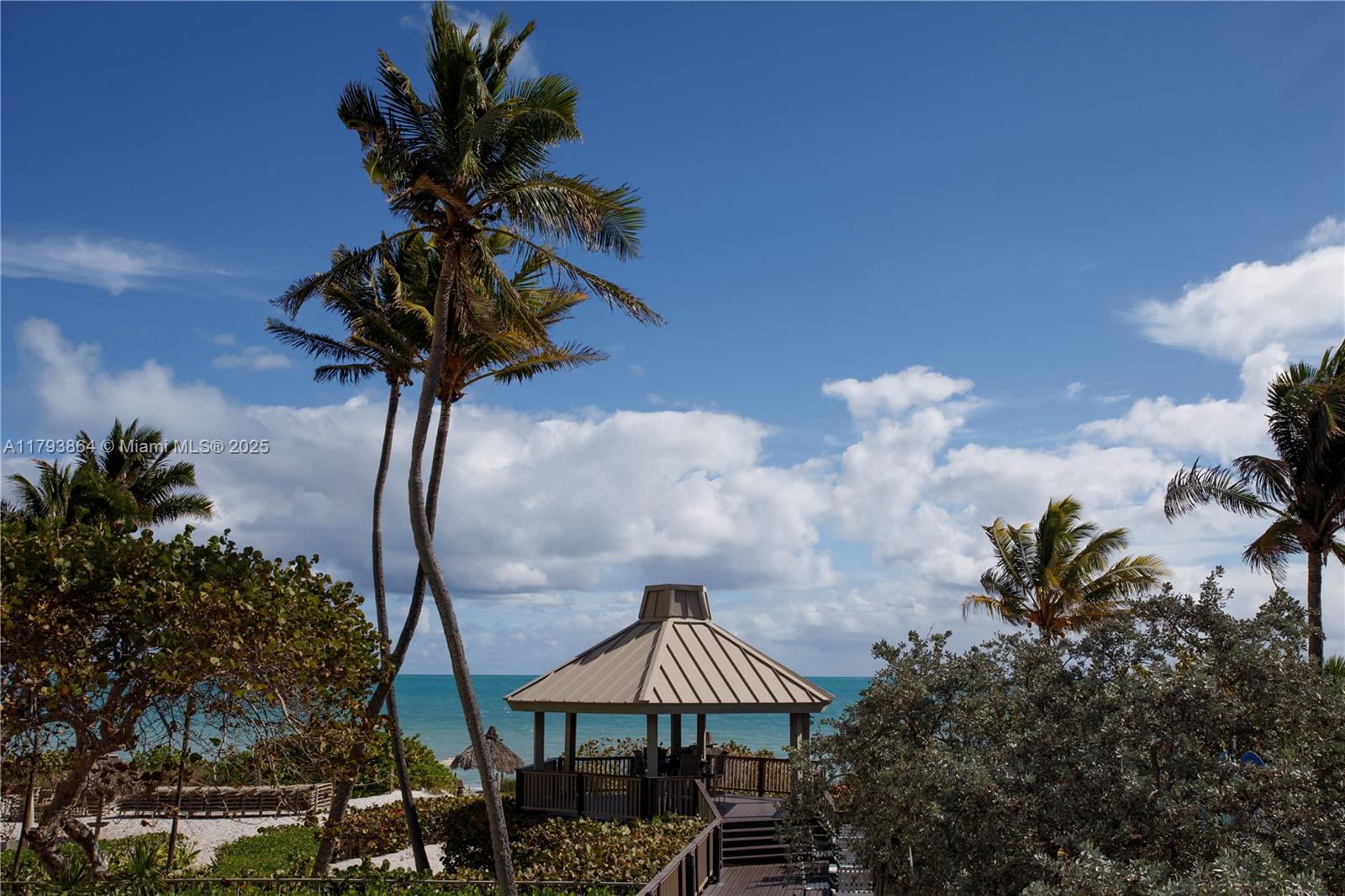 1121 Crandon Boulevard, Unit E1204 Key Biscayne, FL 33149 - Photo 18 of 21 a picture of a tree with a yard