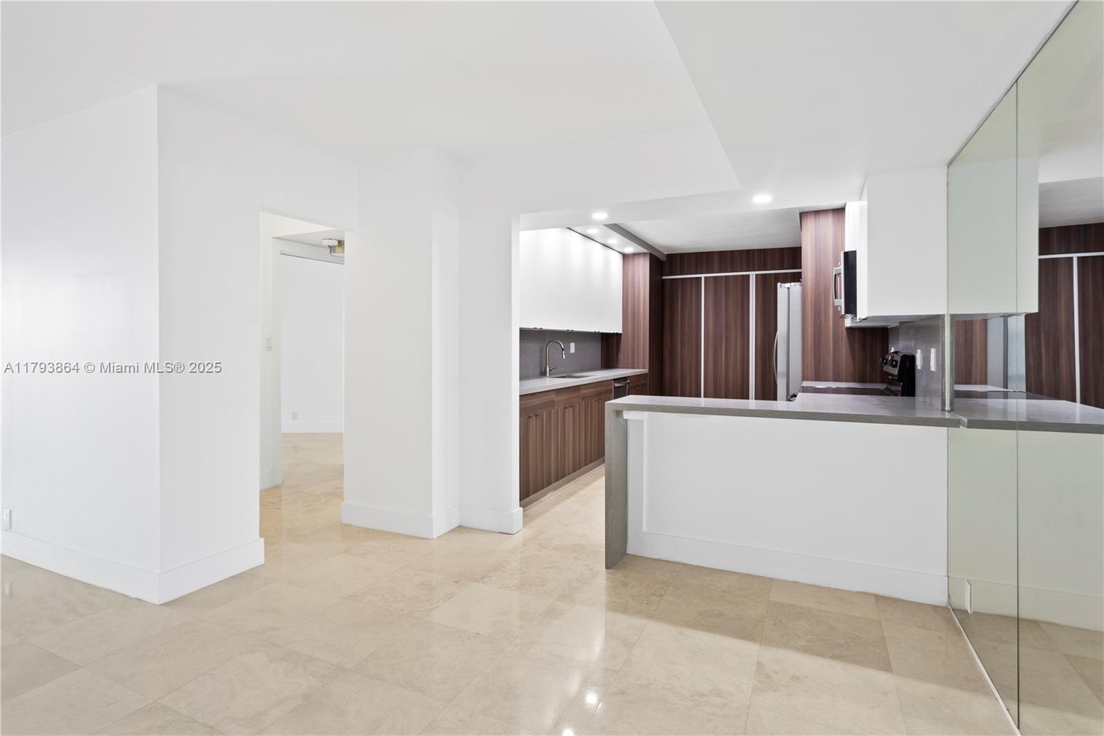 1121 Crandon Boulevard, Unit E1204 Key Biscayne, FL 33149 - Photo 6 of 21 a view of kitchen with refrigerator and window