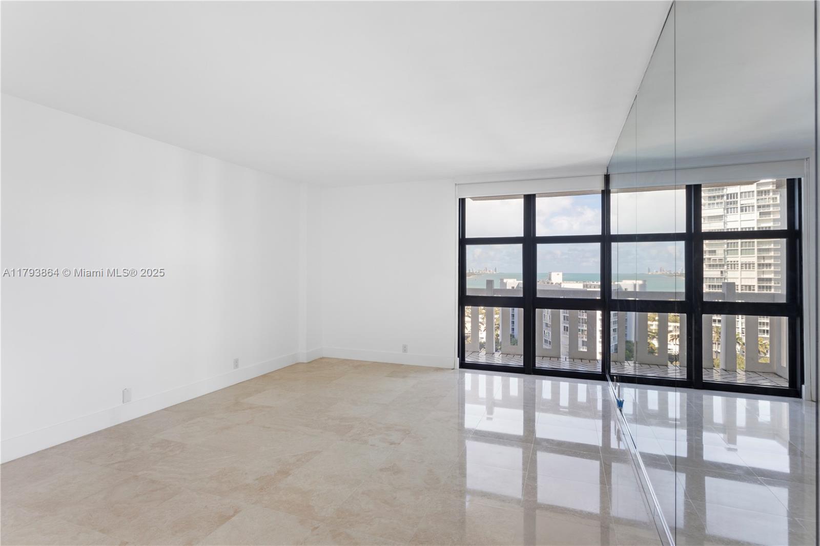 1121 Crandon Boulevard, Unit E1204 Key Biscayne, FL 33149 - Photo 8 of 21 a view of an empty room with a window