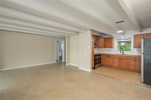 a view of a living room with a large window