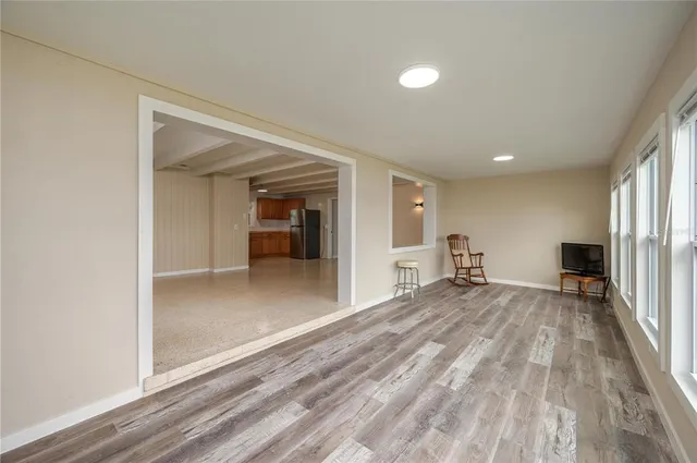 a bathroom with a granite countertop toilet sink and mirror