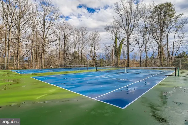 a view of a swimming pool with an outdoor seating