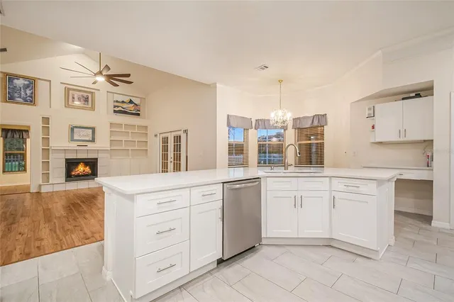 a view of a house with a yard and sitting area