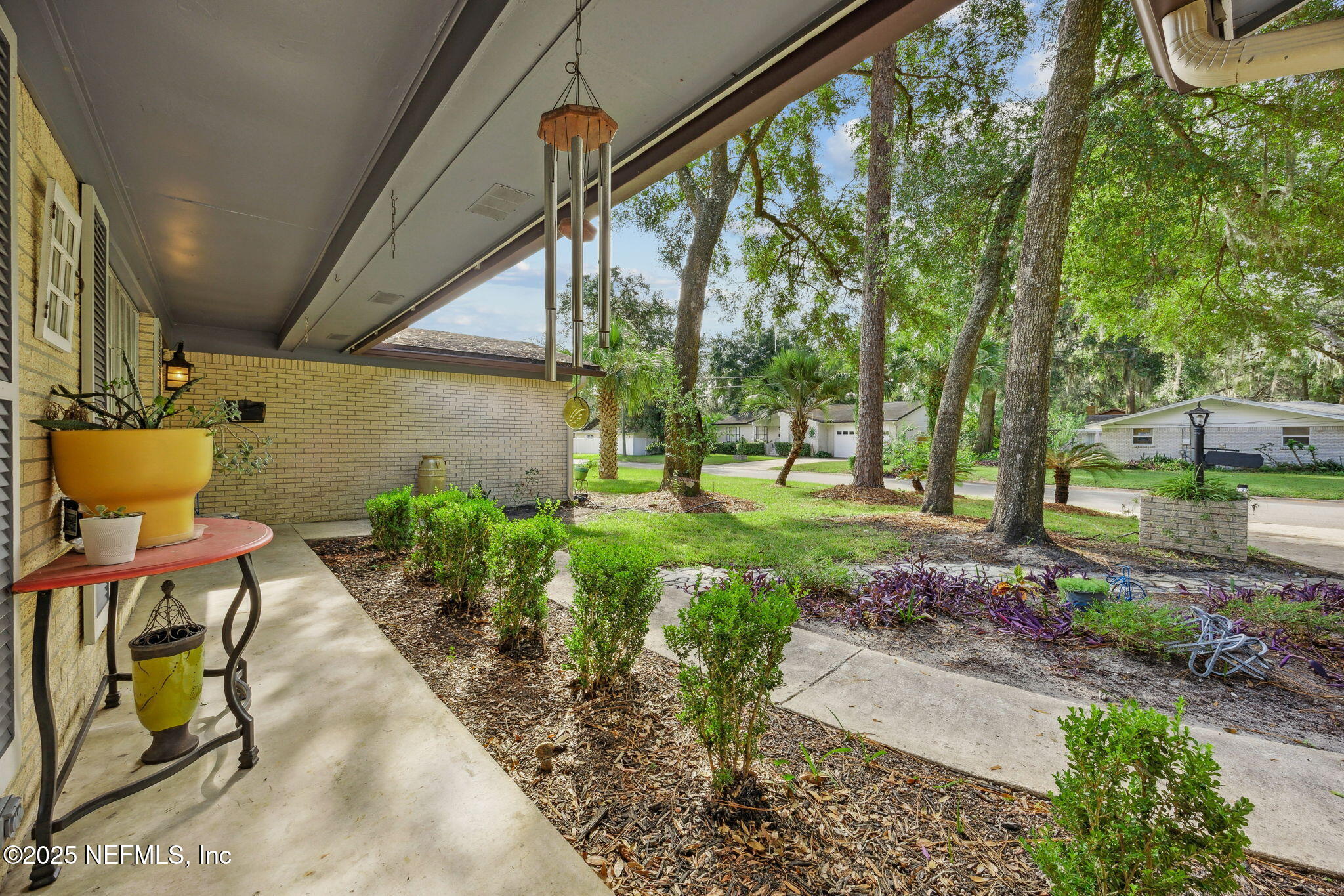 6305 Wuthering Heights Road Jacksonville, FL 32211 - Photo 13 of 53 a garden view with a seating space