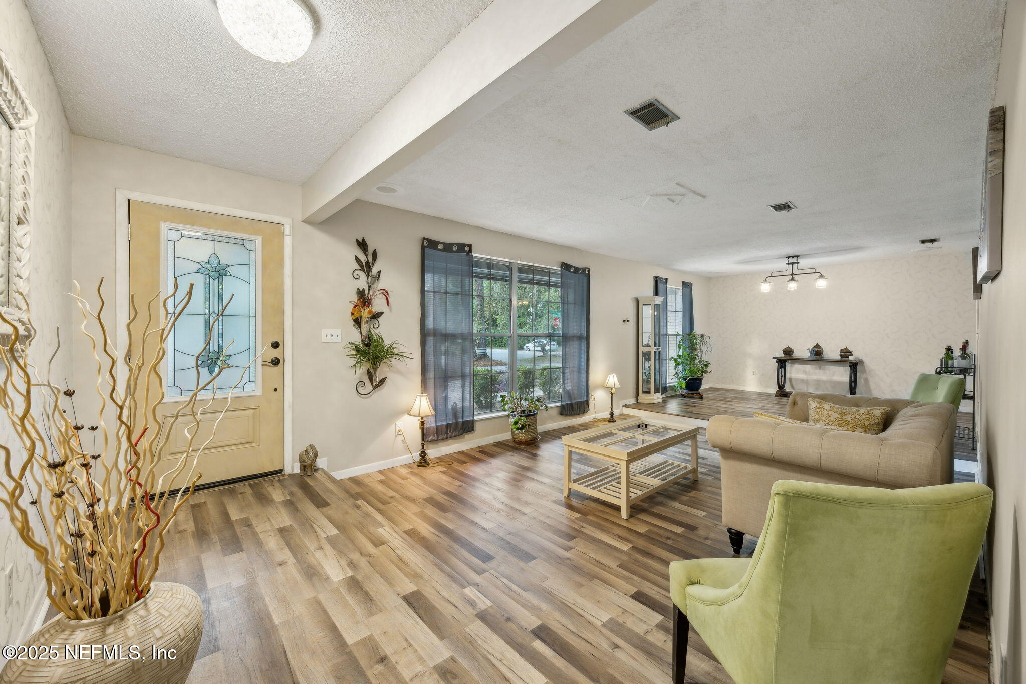 6305 Wuthering Heights Road Jacksonville, FL 32211 - Photo 16 of 53 a living room with furniture and wooden floor