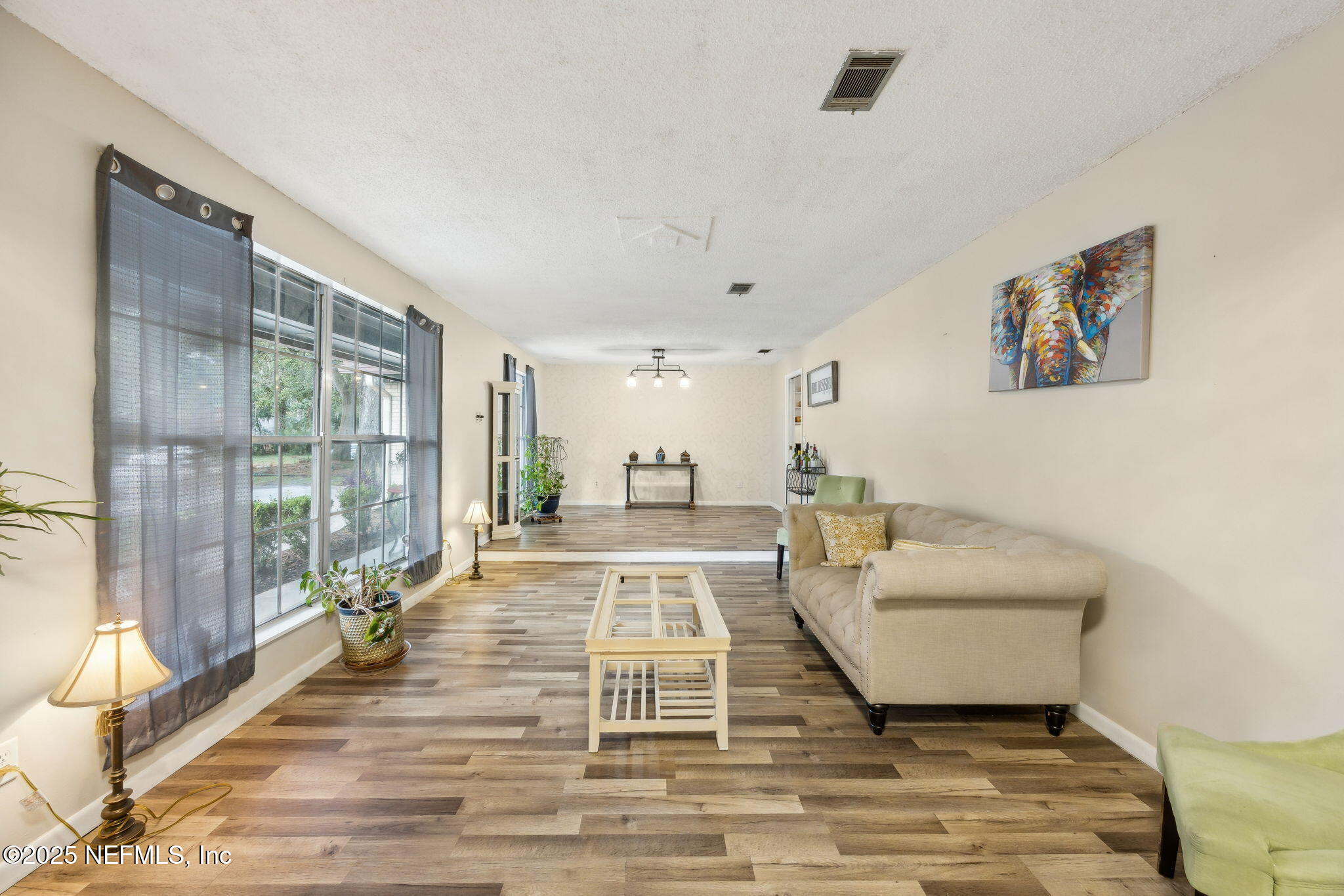 6305 Wuthering Heights Road Jacksonville, FL 32211 - Photo 17 of 53 a living room with furniture and a rug