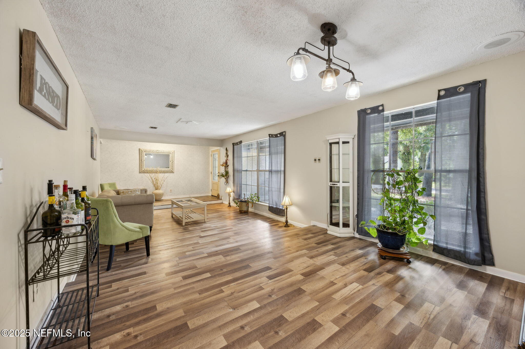 6305 Wuthering Heights Road Jacksonville, FL 32211 - Photo 19 of 53 a view of a livingroom with furniture and wooden floor