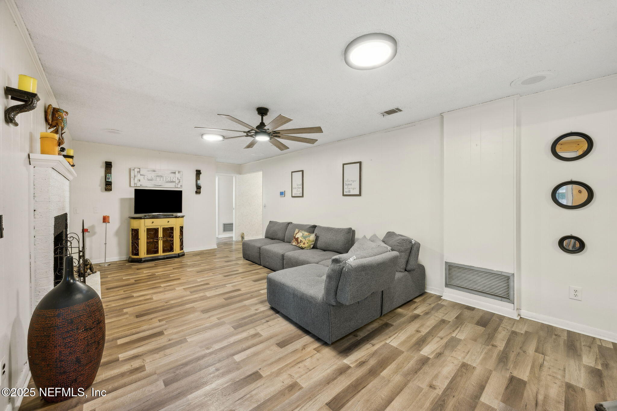 6305 Wuthering Heights Road Jacksonville, FL 32211 - Photo 29 of 53 a living room with furniture and a flat screen tv